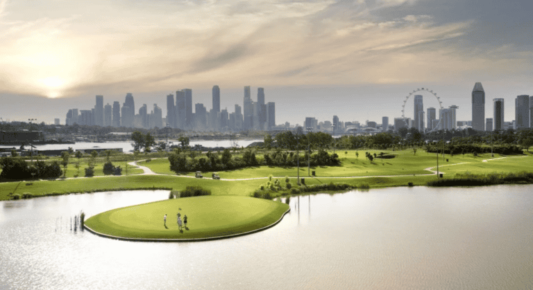 Golfers are playing golf at Marina Bay Golf Course.