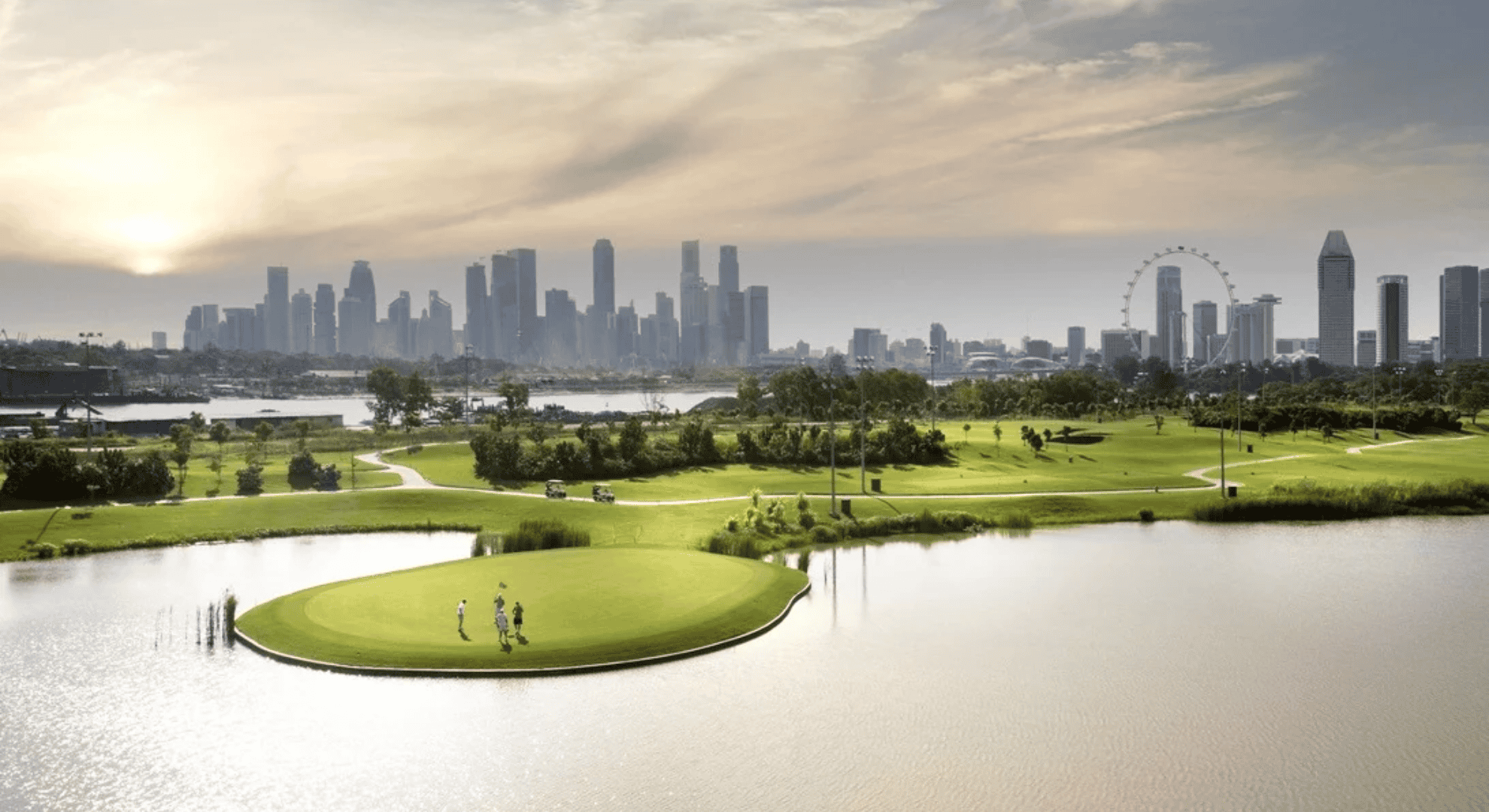 Golfers are playing golf at Marina Bay Golf Course.