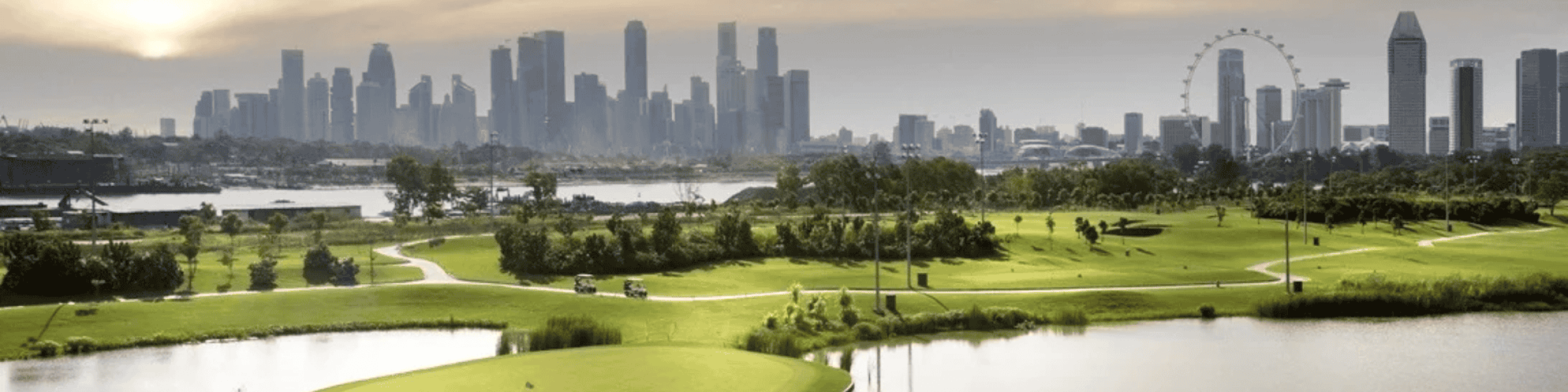 Golfers are playing golf at Marina Bay Golf Course.